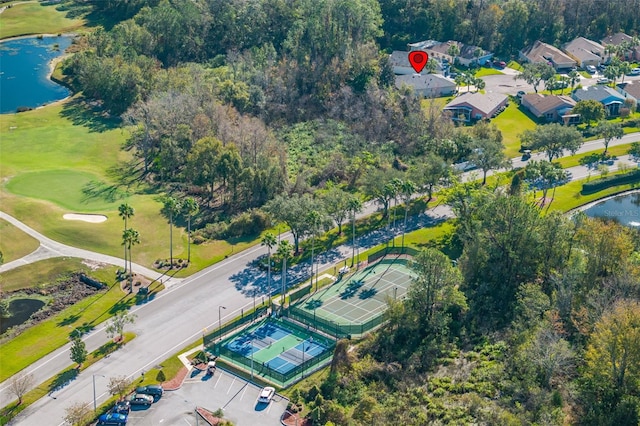 birds eye view of property with a water view