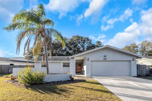 ranch-style home with a front lawn and a garage