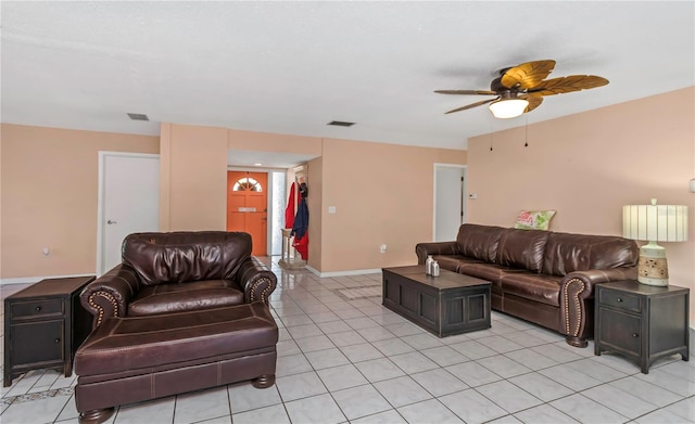 living room with ceiling fan and light tile patterned flooring