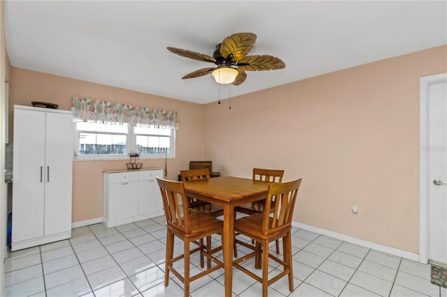 dining room featuring light tile patterned floors and ceiling fan