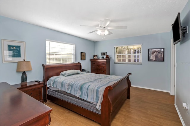 bedroom featuring ceiling fan and light wood-type flooring