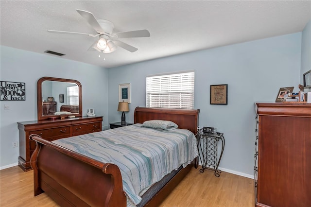 bedroom featuring ceiling fan and light hardwood / wood-style flooring