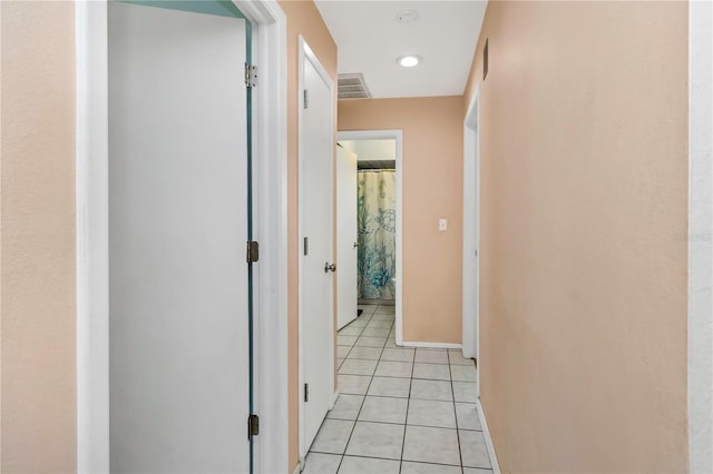 hallway featuring light tile patterned floors