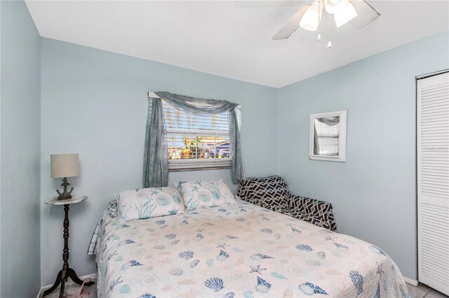 bedroom featuring ceiling fan and a closet