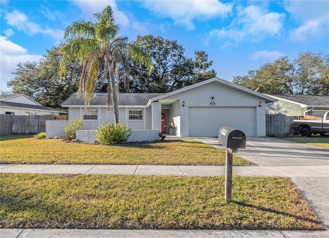 ranch-style home featuring a garage and a front yard