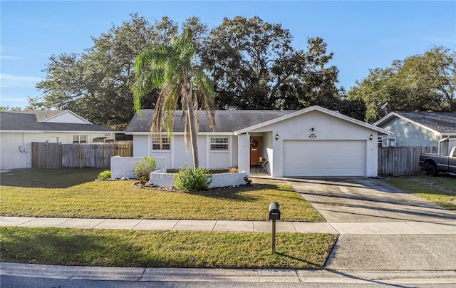 ranch-style house featuring a front yard and a garage