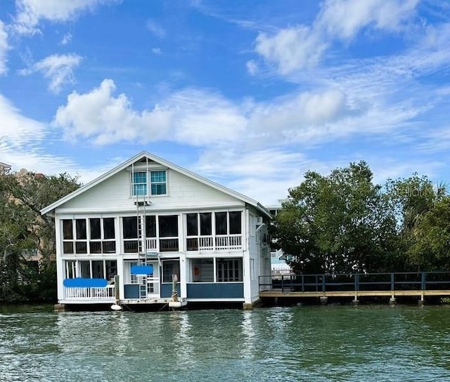 back of house with a water view