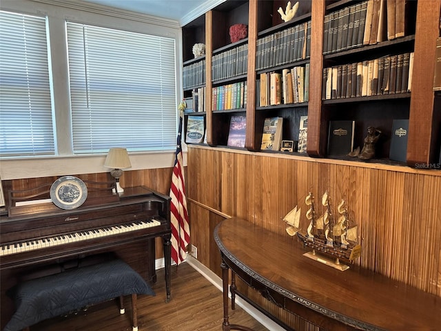 miscellaneous room featuring crown molding and hardwood / wood-style floors