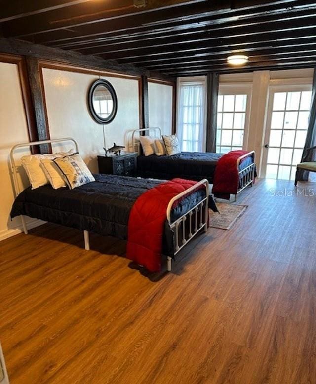 bedroom with hardwood / wood-style floors