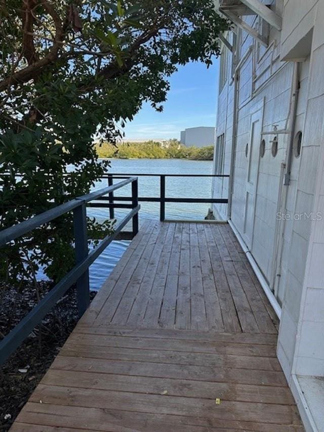 wooden deck featuring a water view