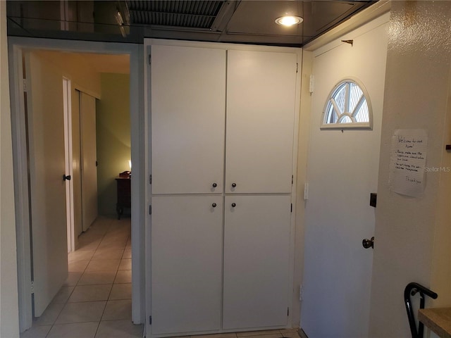 corridor with light tile patterned floors