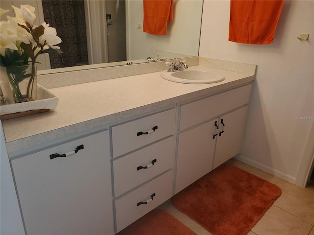 bathroom with tile patterned flooring and vanity