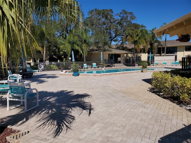 view of swimming pool featuring a patio