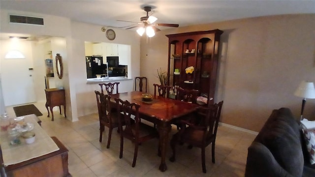 dining room featuring ceiling fan and light tile patterned floors