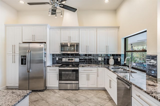 kitchen featuring white cabinetry, sink, and stainless steel appliances