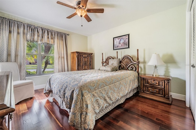 bedroom featuring ceiling fan, dark hardwood / wood-style floors, and a closet