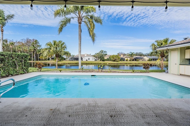 view of pool featuring a water view