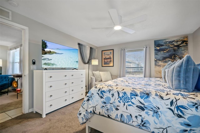 carpeted bedroom featuring ceiling fan