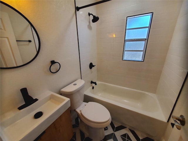 full bathroom with toilet, sink, and tiled shower / bath