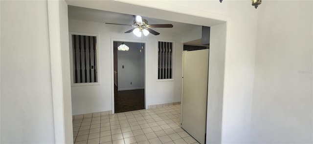 hallway featuring light tile patterned floors