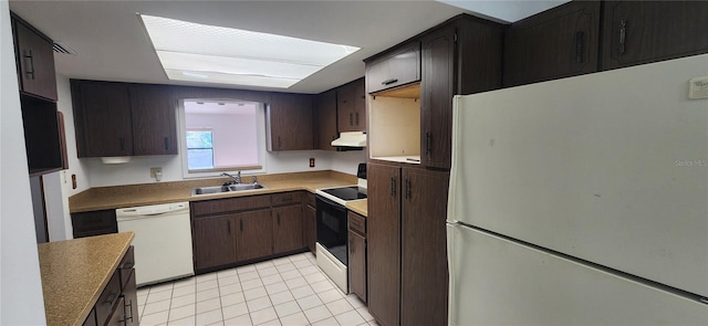 kitchen featuring light tile patterned flooring, white appliances, dark brown cabinetry, and sink