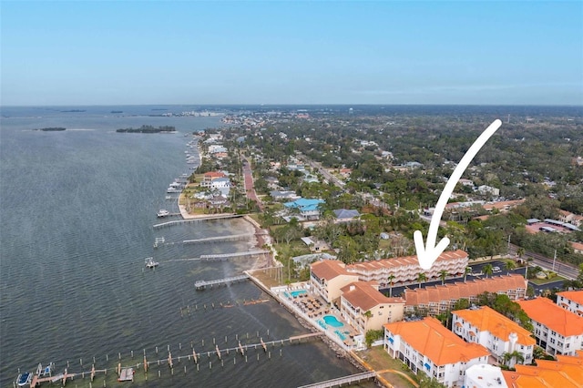 birds eye view of property with a water view