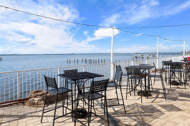 view of patio featuring a water view