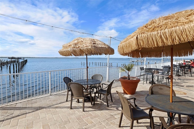 view of patio with a water view