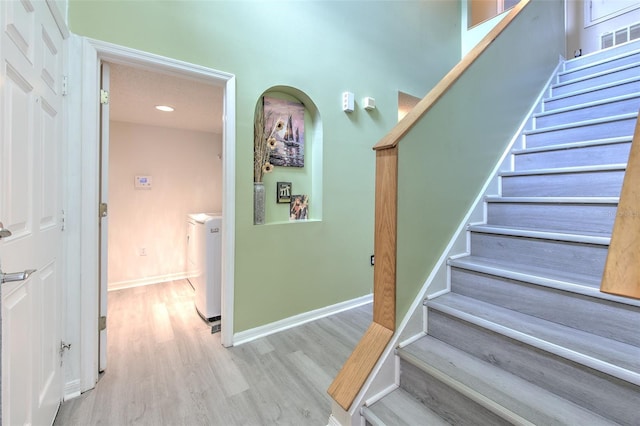 staircase featuring hardwood / wood-style floors