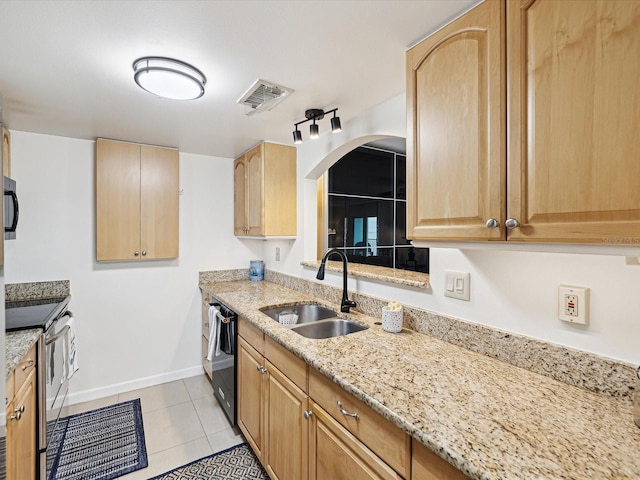 kitchen featuring stainless steel range with electric stovetop, light stone countertops, light tile patterned floors, black dishwasher, and sink