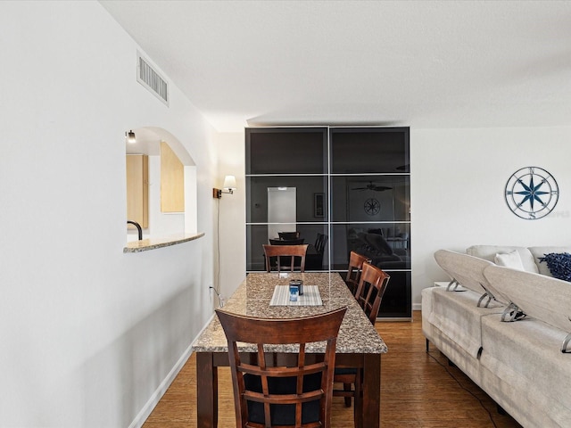 dining room with wood-type flooring