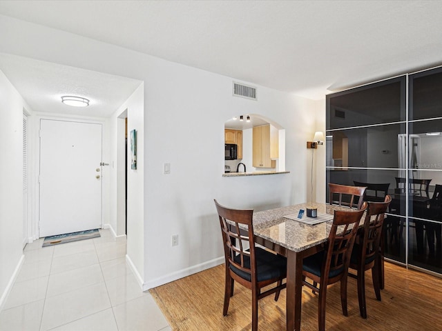 dining room with light tile patterned floors