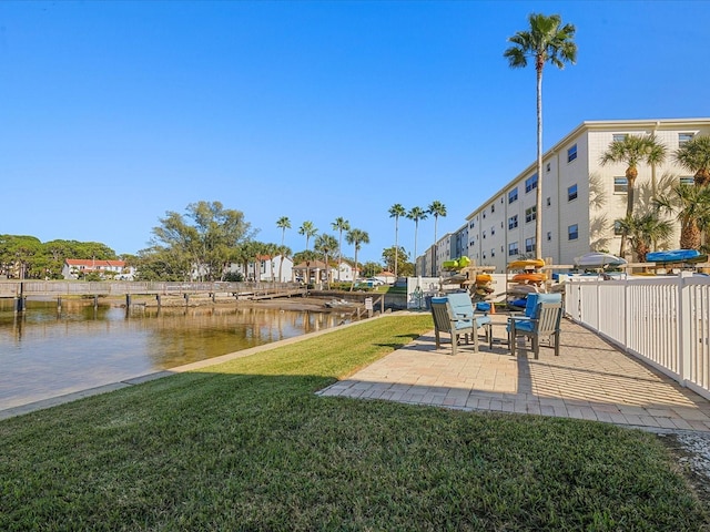 view of yard featuring a patio and a water view