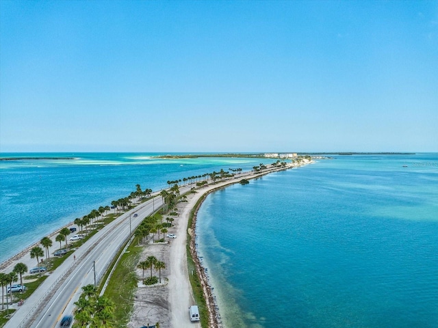 bird's eye view with a water view and a view of the beach