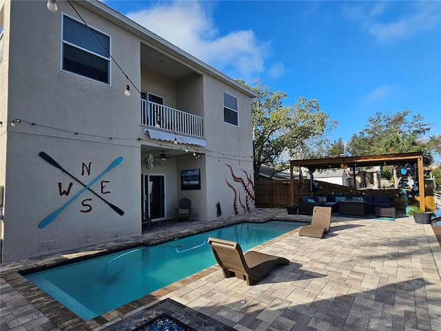 view of pool with ceiling fan, an outdoor hangout area, and a patio