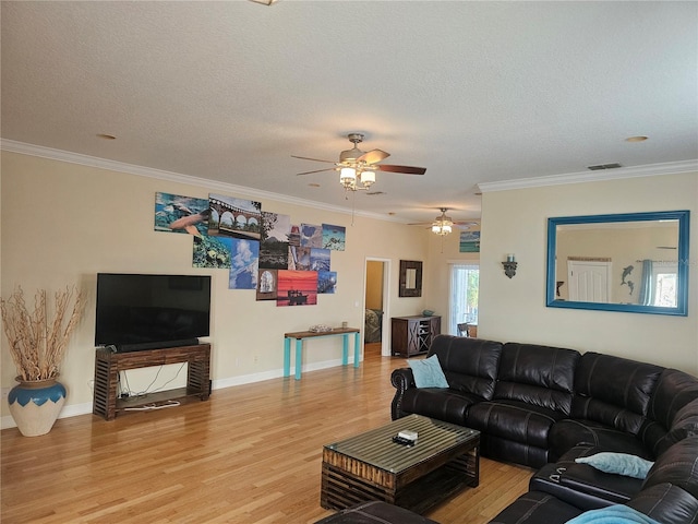 living room with a textured ceiling, ceiling fan, crown molding, and light hardwood / wood-style flooring