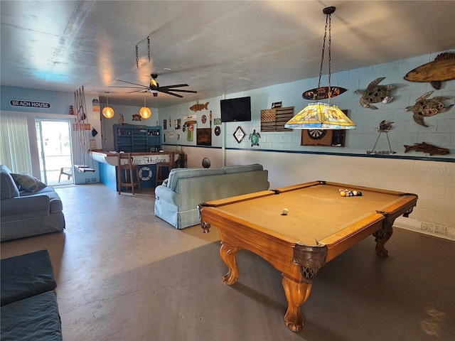 game room with concrete flooring, ceiling fan, and billiards