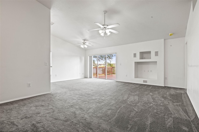 unfurnished living room featuring ceiling fan, dark carpet, and lofted ceiling