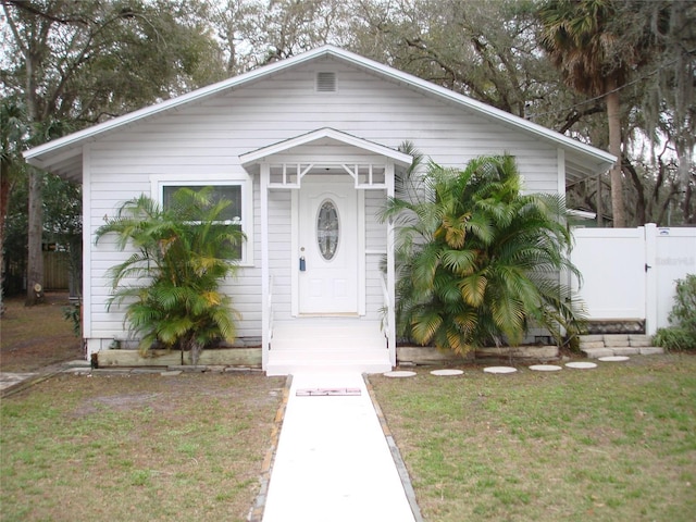 view of front of home with a front lawn