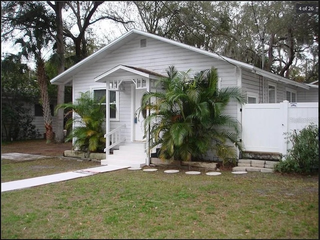 view of front of property with a front lawn