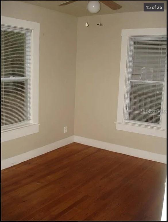 empty room with hardwood / wood-style flooring