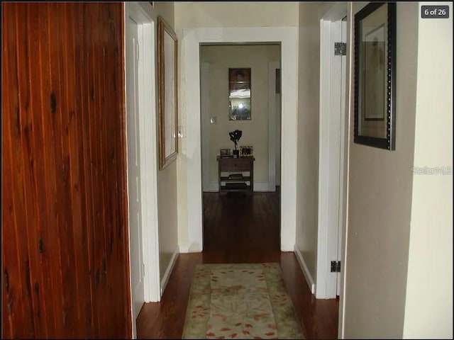 hall with dark hardwood / wood-style floors