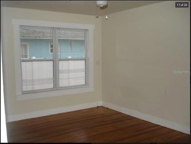 unfurnished room featuring wood-type flooring