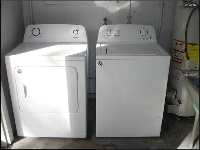 washroom featuring gas water heater and independent washer and dryer