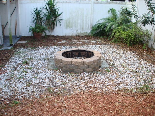 view of yard with a fire pit