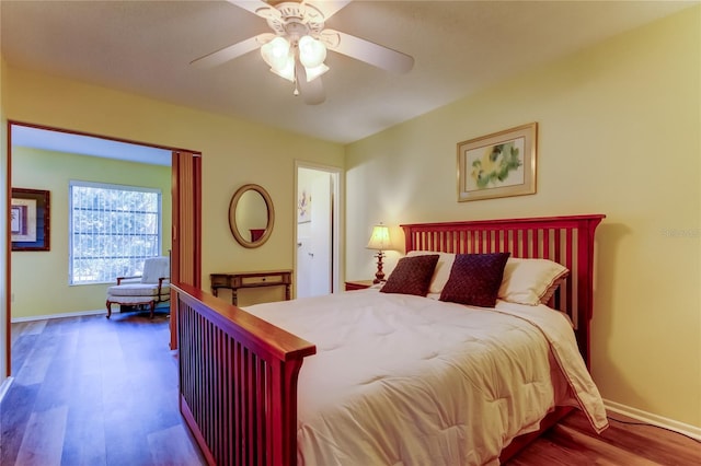 bedroom with wood-type flooring and ceiling fan