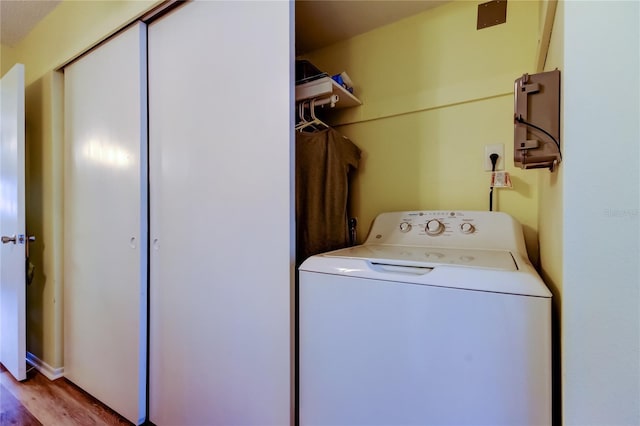 laundry room with light hardwood / wood-style floors and washer / clothes dryer