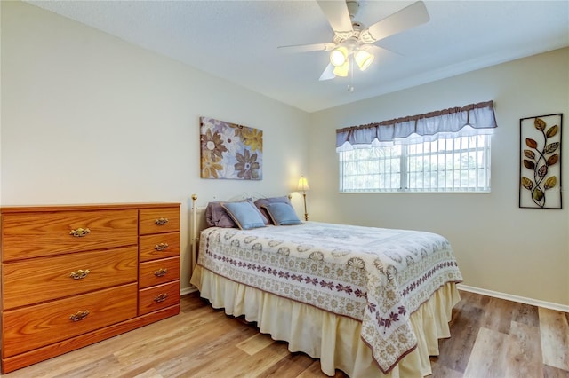 bedroom featuring ceiling fan and light wood-type flooring