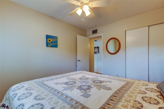 bedroom featuring ceiling fan and a closet