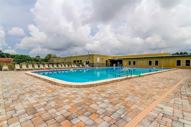 view of swimming pool featuring a patio